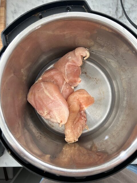 frozen chicken breasts in instant pot with a cup of water